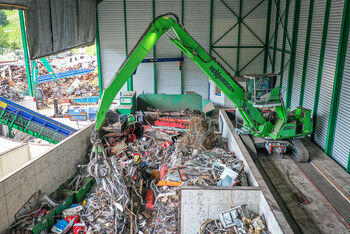 SENNEBOGEN 830 electric material handler with orange peel grab recycling waste management scrap handling