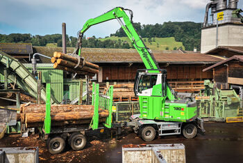 34,1 t material handler SENNEBOGEN 730 E timber handling in sawmill log yard sorting line with trailer