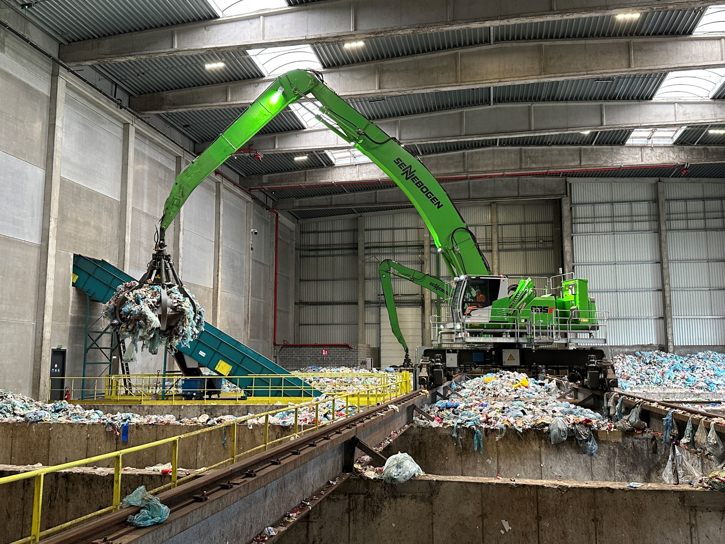 Waste sorting in the hall electric material handlers replace overhead