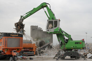 SENNEBOGEN material handler 821 E mobile shredder feeding recycling waste management sorting grab