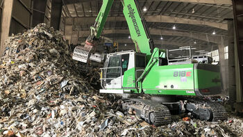 SENNEBOGEN 818 E material handler during recycling handling work in the USA
