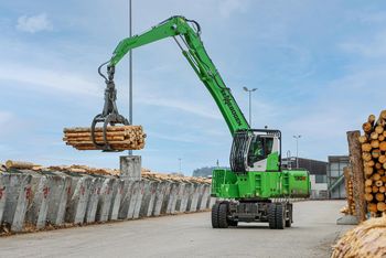 SENNEBOGEN material handler in saw mill, log transport, timber handling with timber grab SENNEBOGEN material handler in saw mill, log transport, timber handling with timber grab