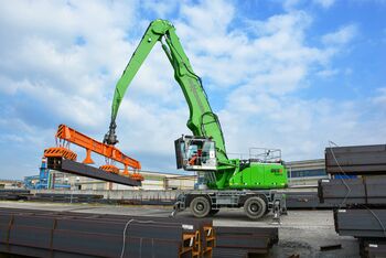 Steel logistics with SENNEBOGEN 865 E Hybrid, material handler with a magnetic lifting beam material handler with magnetic lifting beam