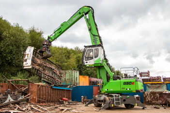 SENNEBOGEN 830 E material handler during scrap recycling handling work