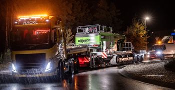 The SENNEBOGEN 824 G Electro during night-time heavy transport.