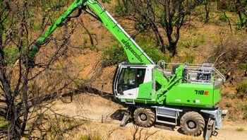 SENNEBOGEN 718 timber material handler, forest excavator for clearing up forest fires in California, USA