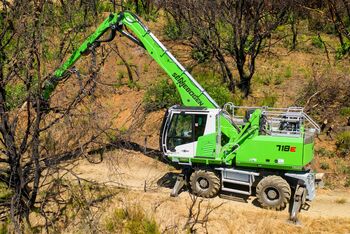SENNEBOGEN 718 timber material handler, forest excavator for clearing up forest fires in California, USA