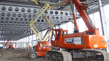 Packaging Centre for Amazon: SENNEBOGEN 643 R at Work in Tilbury, Essex