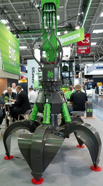 SENNEBOGEN MG4.1 orange peel grab on display at IFAT for scrap and recycling applications.