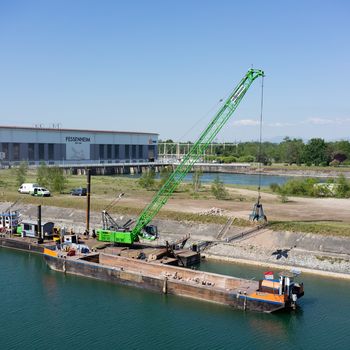 Hydraulic engineering, 55 t duty cycle crane, pontoon with SENNEBOGEN 655 HD, river engineering, special civil engineering works