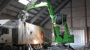 SENNEBOGEN 817 E material handler during recycling handling work