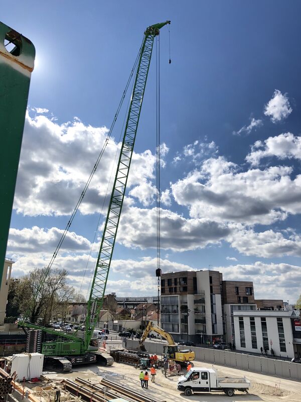 SENNEBOGEN 6140 HD rope excavator and 7700 R-SL crawler crane used in building construction / civil engineering for Grand Paris Express in France
