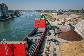 Port material handling with SENNEBOGEN 870 crawler gantry , unloading of steel wire coils, loading of heavy cargo and bulk material