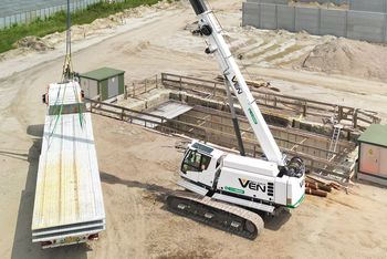 SENNEBOGEN 653 Electro Battery crane lifting precast concrete elements during the construction of an electric bus depot in Breda.
