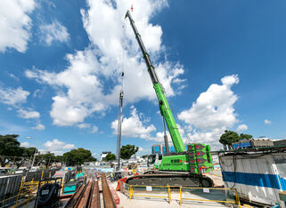 SENNEBOGEN telescopic crawler crane 6133 sheet piling Singapore, sewage tunnel