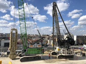 SENNEBOGEN 6140 heavy duty cycle crawler crane and 7700 R-SL crawler crane used in building construction / civil engineering for Grand Paris Express in France
