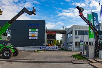 SENNEBOGEN telehandler welcoming visitors at the Ascendum facility entrance.