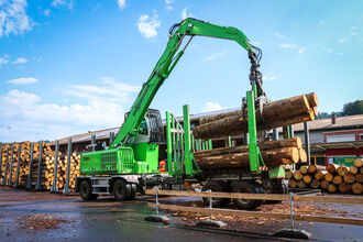 SENNEBOGEN 730 timber handling machine in Pick & Carry application with trailer, saw mill, Switzerland