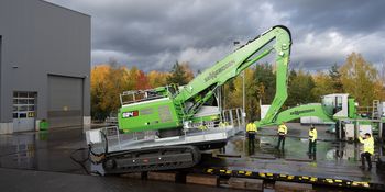 The SENNEBOGEN 824 G Electro is being loaded onto a low-loader for heavy transport.