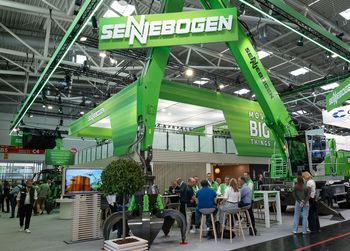 SENNEBOGEN exhibition stand at IFAT showcasing machines and technologies for recycling and material handling.