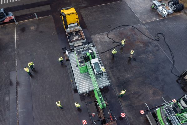 SENNEBOGEN 822 G transported as a complete unit on a low-loader.