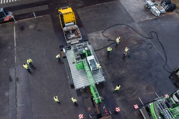 SENNEBOGEN 822 G transported as a complete unit on a low-loader.