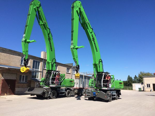 SENNEBOGEN 835 dredger handling wood in Latvia