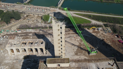 SENNEBOGEN 6300 Duty cycle crane demolishing a building with a wrecking ball