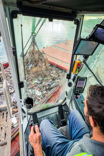 View from the operator's cab of the SENNEBOGEN 870 E overlooking scrap metal during port handling operations in Hereke.