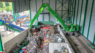 SENNEBOGEN 830 electric excavator with 17 m equipment and 800 l orange peel grab, scrap recycling, Switzerland